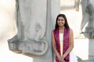 Sejal Gupta stands next to Pylons